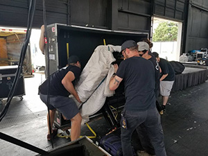 men moving a piano